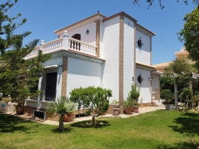 Casa con jardín en la playa